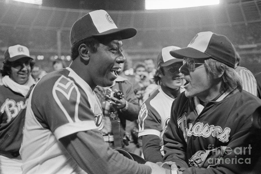 Hank Aaron And Tom House Shaking Hands by Bettmann