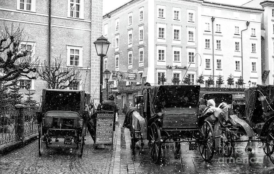 Hansom Cabs at Residenzplatz in Salzburg Photograph by John Rizzuto