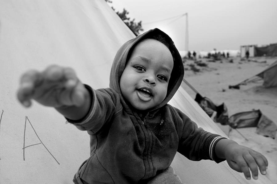 Black And White Photograph - Happy Child by Nicola Fossella