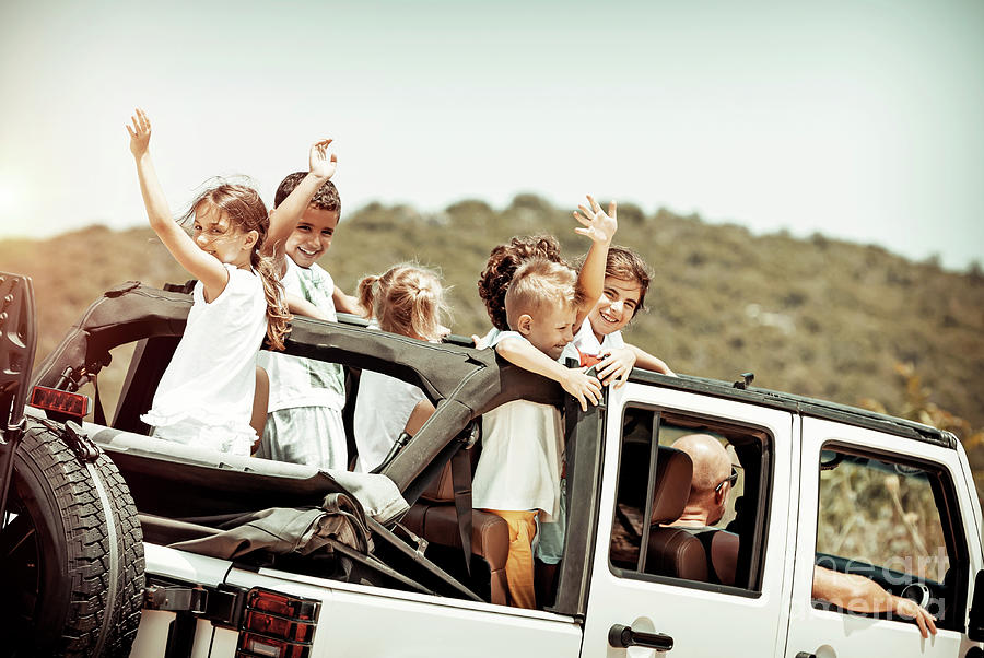 Happy kids enjoying road trip Photograph by Anna Om