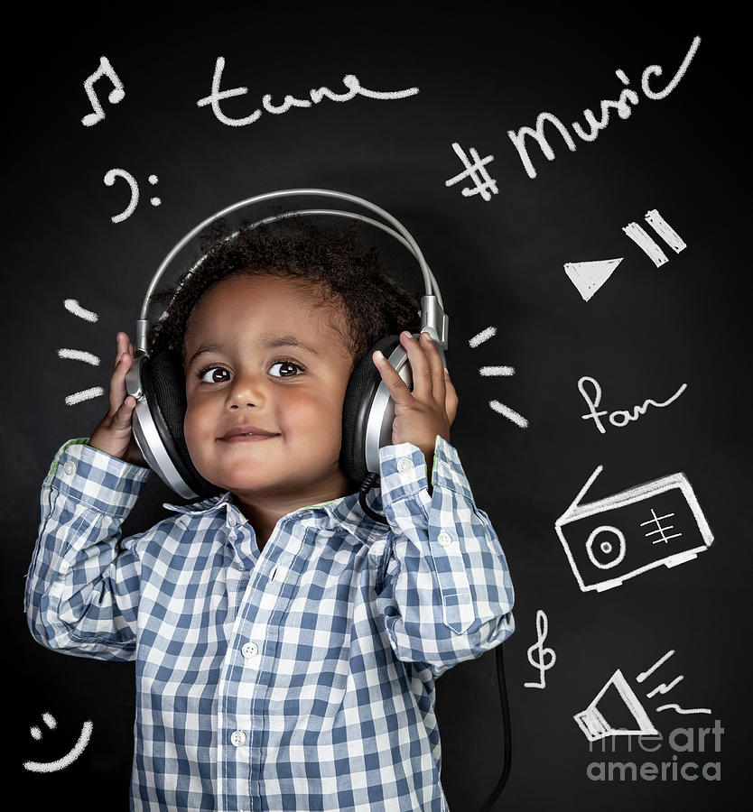 Happy little boy listening music Photograph by Anna Om
