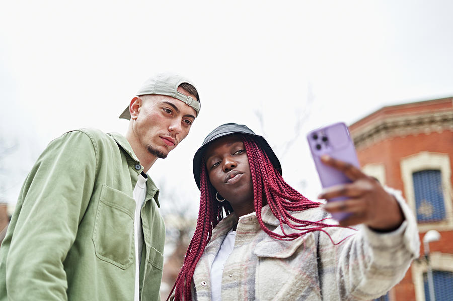 Cool Photograph - Happy Multiethnic Couple Taking Selfie by Cavan Images / Adalberto Rodriguez