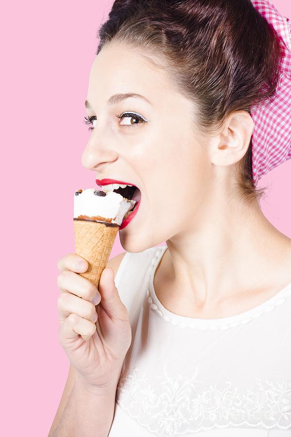 Happy pin-up woman eating ice cream closeup Photograph by Jorgo Photography