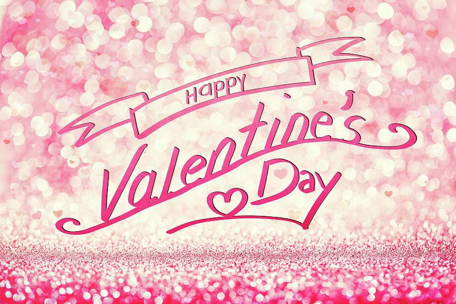 HAPPY VALENTINES DAY writing on glittery pink background. Photograph by Michal Bednarek
