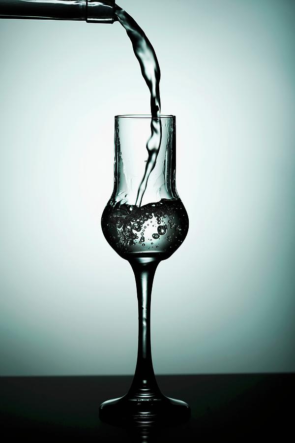 Hard Liquor Being Poured Into A Glass Photograph by Ina Peters
