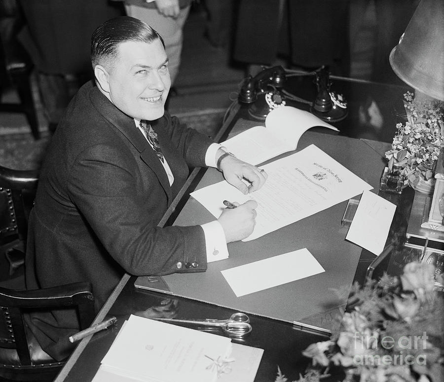 Harold Hoffman Writing At His Desk Photograph by Bettmann