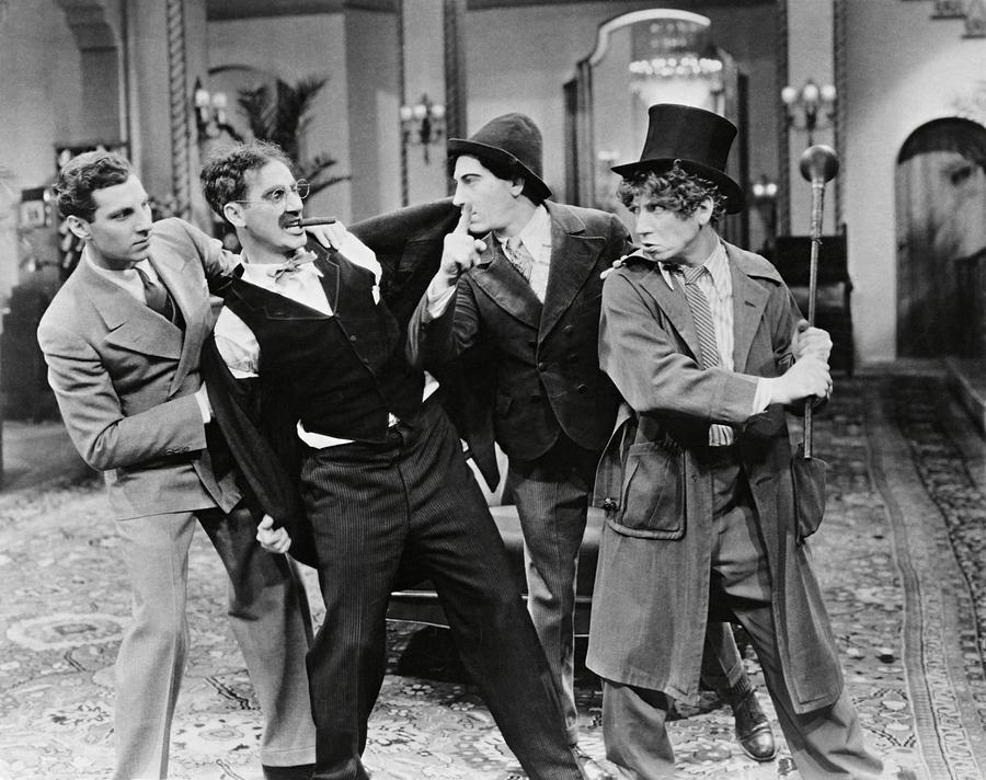 HARPO MARX , THE MARX BROTHERS , CHICO MARX and GROUCHO MARX in THE COCOANUTS -1929-. Photograph by Album