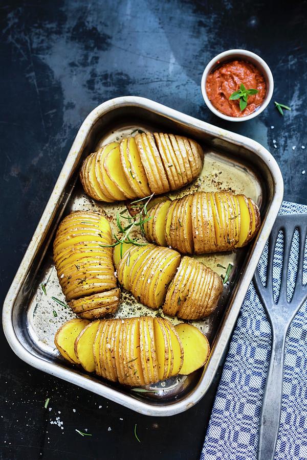 Hasselback Potatoes With Raw Ketchup Photograph by Brigitte Sporrer