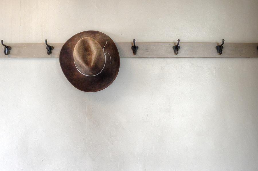 Hat on a Rack Photograph by Debra Kewley