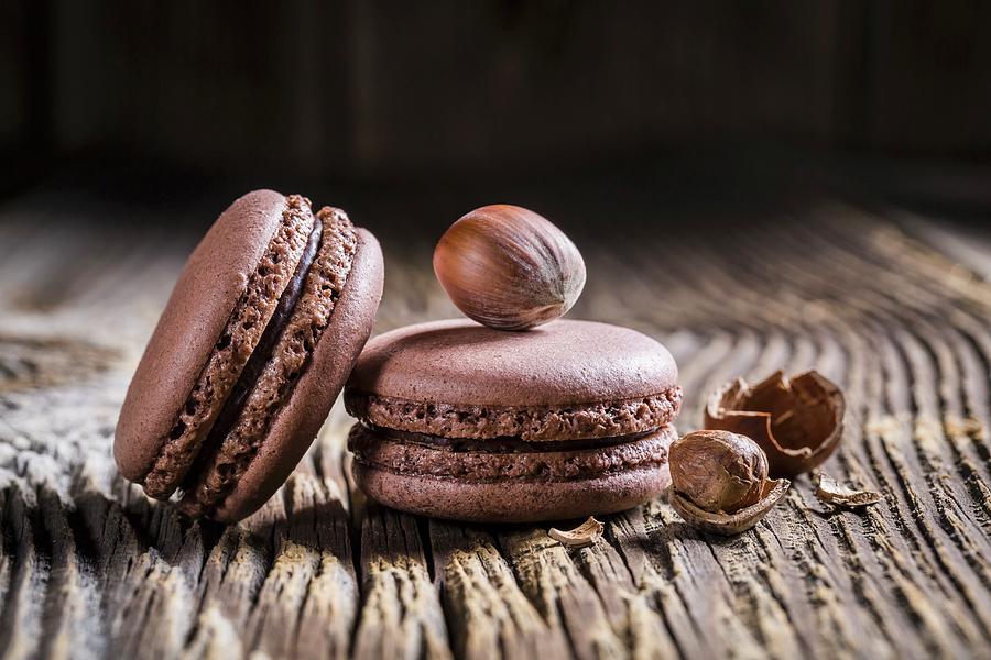 Hazelnut Macaroons On A Wooden Table Photograph by Shaiith