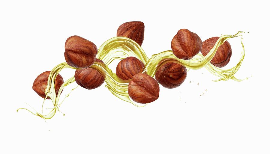 Hazelnuts With A Splash Of Oil Photograph by Krger & Gross