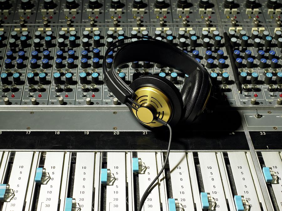 Headphones On A Mixing Desk Photograph by Image Source