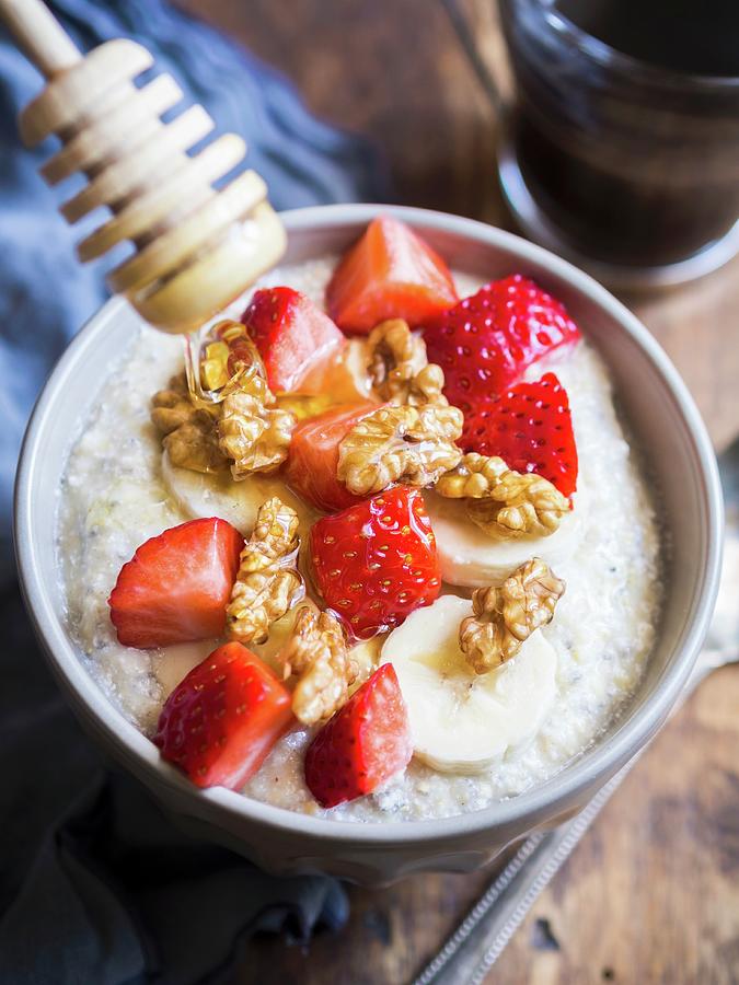 Healthy Breakfast: Oatmeal Porigge With Coco, Chia Seeds, Nuts, Fresh Fruit And Honey Photograph by Magdalena Paluchowska