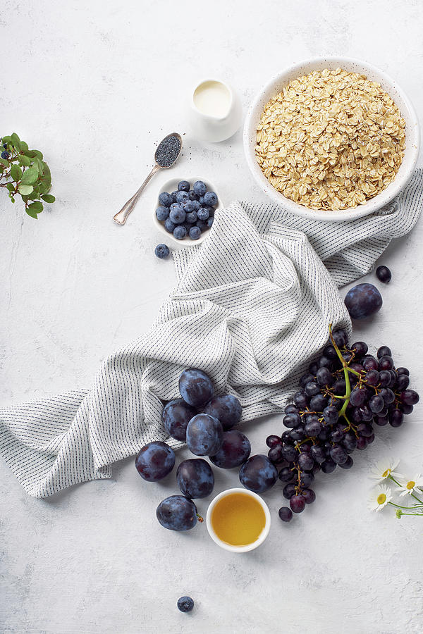 Healthy Breakfast With Oats, Plums And Grapes Photograph by Asya Nurullina