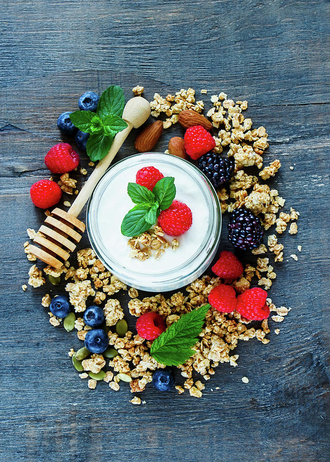 Healthy Cereal Ingredients: Yoghurt, Granola, Berries And Almonds top View Photograph by Yuliya Gontar