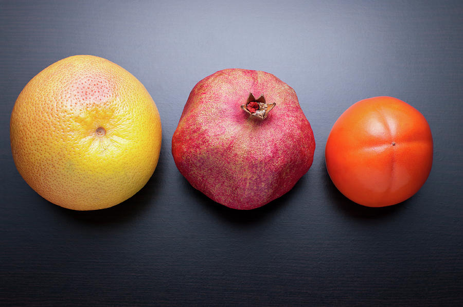 Healthy Fruits On Dark Wooden Background Photograph by Daitozen