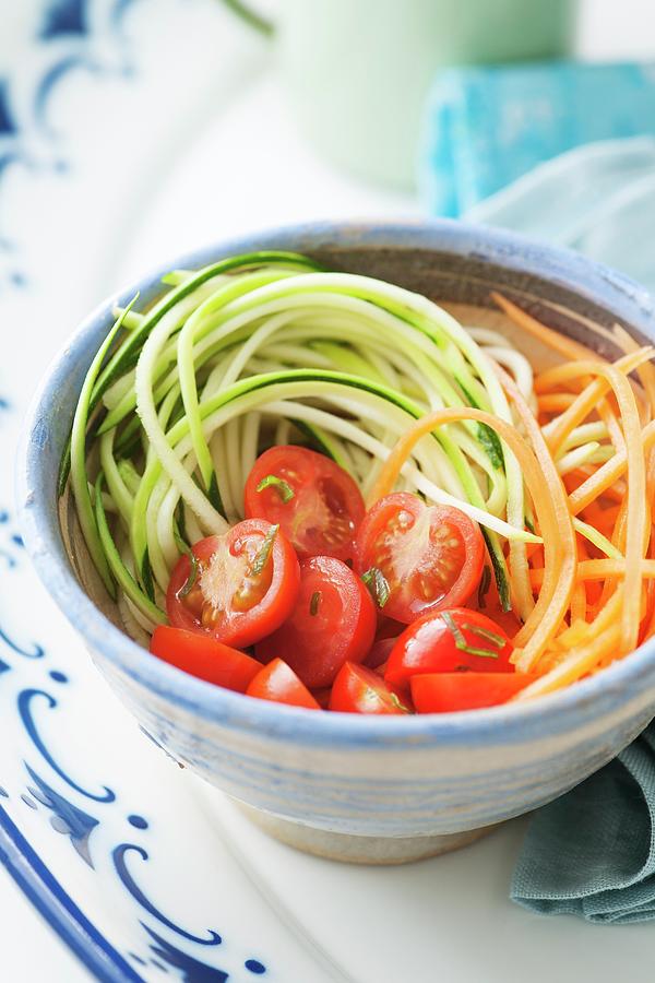 Healthy Low Fat Salad Of Courgette And Carrot Spaghetti With Cherry Tomatoes Photograph by Victoria Firmston