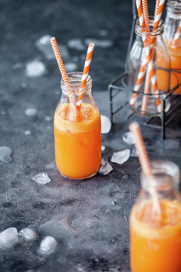 Healthy Vegetable Juice With Carrots, Ginger And Orange Photograph by Kati Finell
