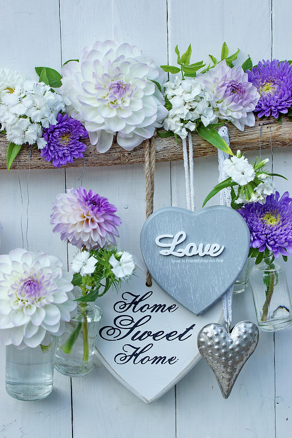 Heart Decorations And Small Suspended Bottles Holding Dahlias And Asters Photograph by Angelica Linnhoff