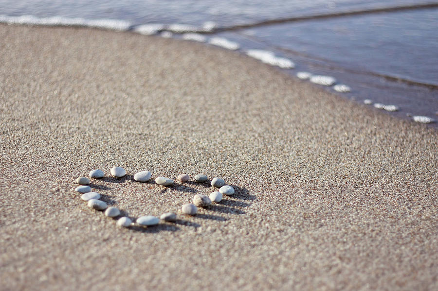 Heart Made Of Pebbles On Sand Photograph by Angelika Kaczanowska