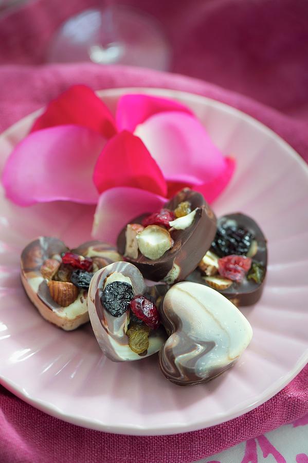 Heart-shaped Chocolates With Dried Fruit And Nuts Photograph by Winfried Heinze
