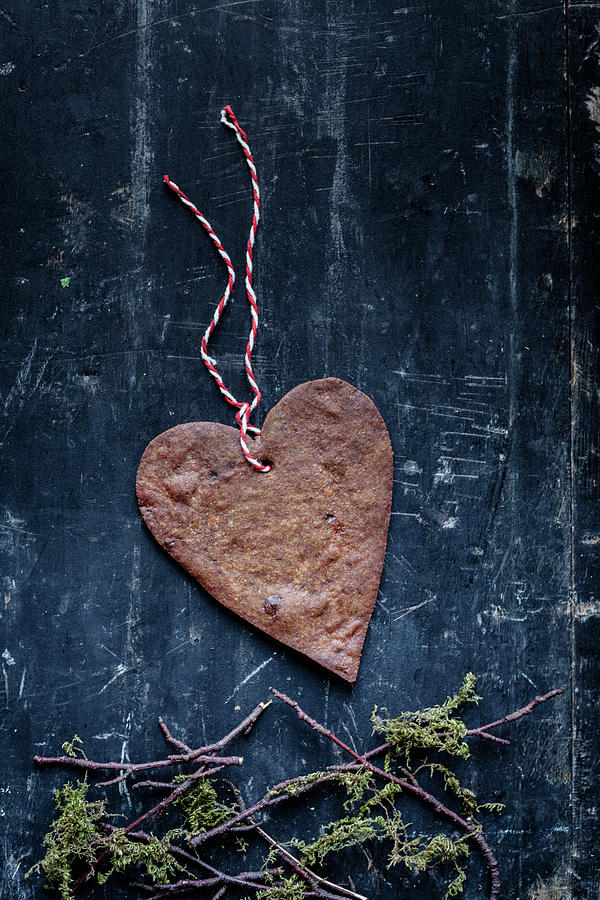 Heart Shaped Christmas Ginger Biscuits With Decorative String Photograph by Joan Ransley
