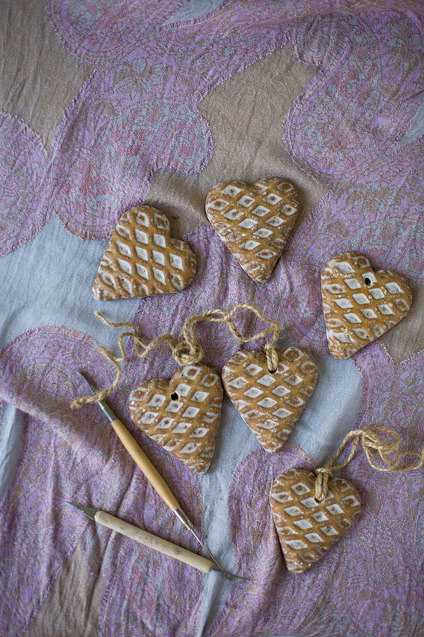 Heart-shaped Pendants With Waffle Structure On Pink Patterned Cloth Photograph by Alicja Koll
