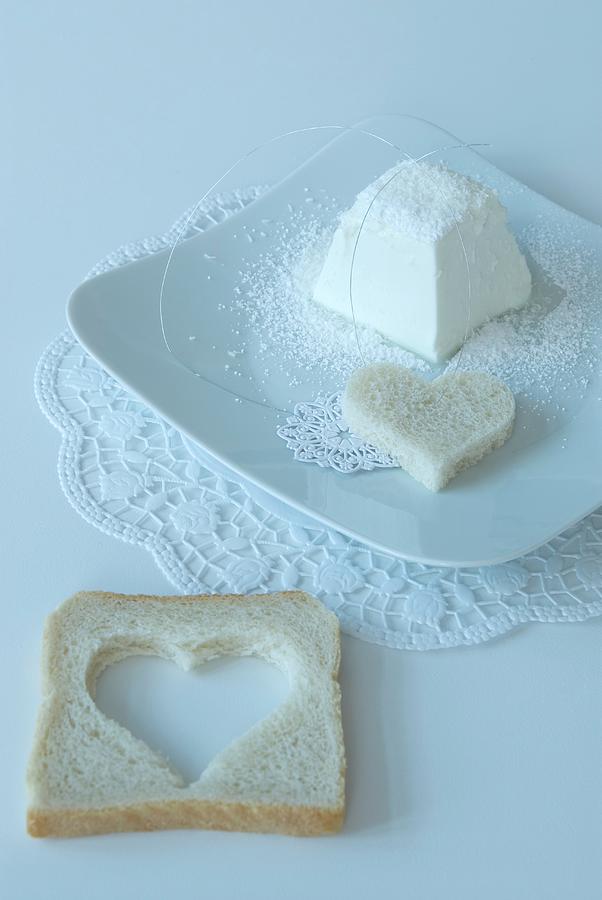 Heart-shaped Slice Of Bread On Doily On White Place Setting Photograph by Matteo Manduzio