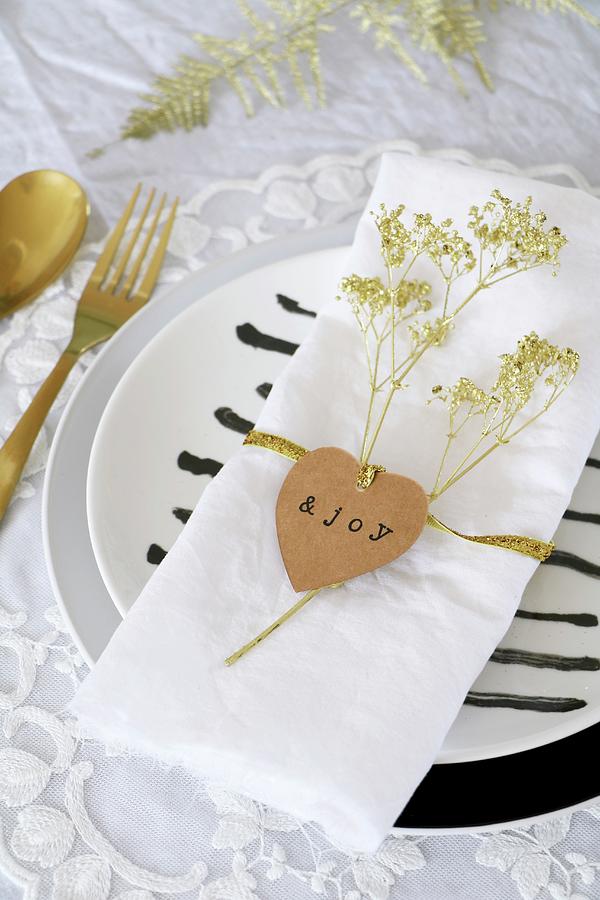 Heart-shaped Tag And Dried Flower Sprayed Gold On Napkin Photograph by Marij Hessel