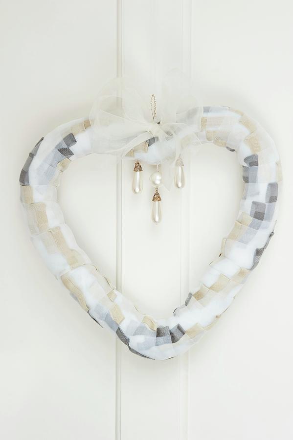 Heart-shaped Wreath Made Of Chiffon Ribbon With Pearl Drop Beads As Wedding Decoration Photograph by Jasmine Burgess