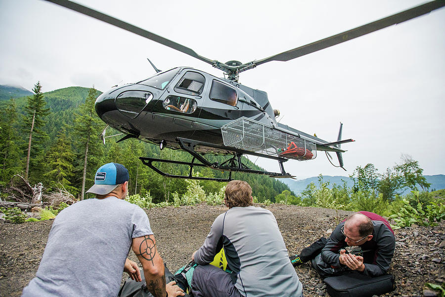 Transportation Photograph - Helicopter Drops Off Three Men At A Remote Destination In B.c. by Cavan Images