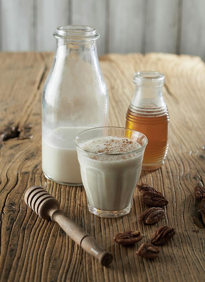 Hemp Milk, Honey, Nutmeg And Pecan Nuts Photograph by Charlotte Kibbles