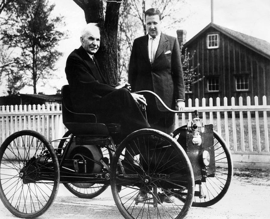 Henry Ford Sits In His First Ford Car Photograph by Everett