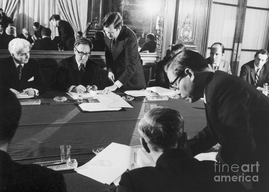 Henry Kissinger Signs Cease Fire Photograph by Bettmann Henry Kissinger Signs Cease Fire Photograph by Bettmann