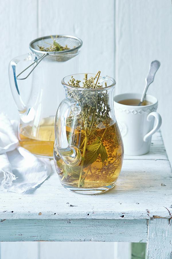 Herb Infused Tea In Pitcher Photograph by Alena Hrbkov