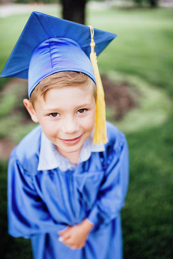 High Angle Portrait Of Smiling Boy In Graduation Gown Standing On ...