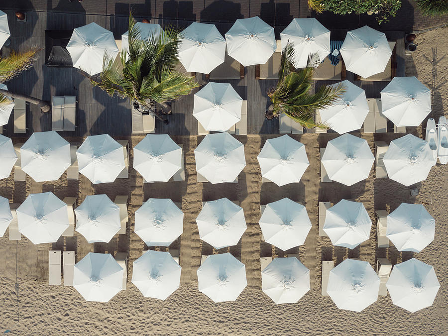 High Angle View Of Umbrellas Arranged On Sand At Beach During Sunny Day Photograph by Cavan Images High Angle View Of Umbrellas Arranged On Sand At Beach During Sunny Day Photograph by Cavan Images