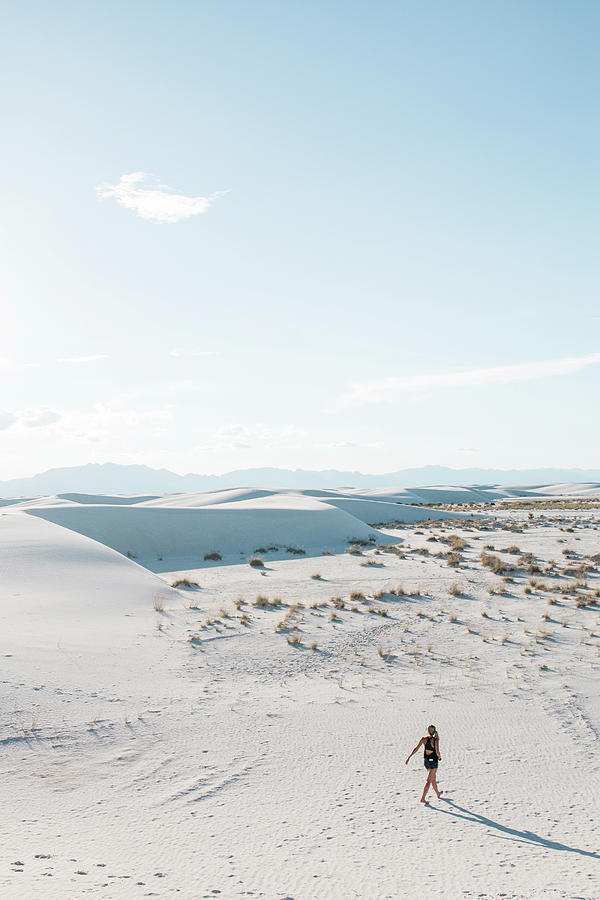 White Sands National Monument Photograph - High Angle View Of Woman Walking At White Sands National Monument Against Sky During Sunny Day by Cavan Images