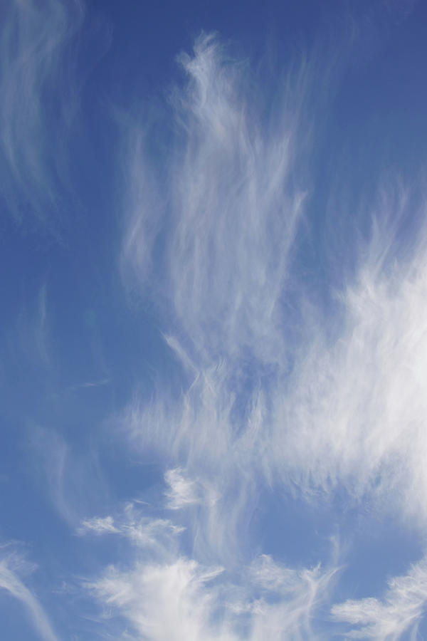 High cirrus clouds and blue sky Photograph by Steve Estvanik