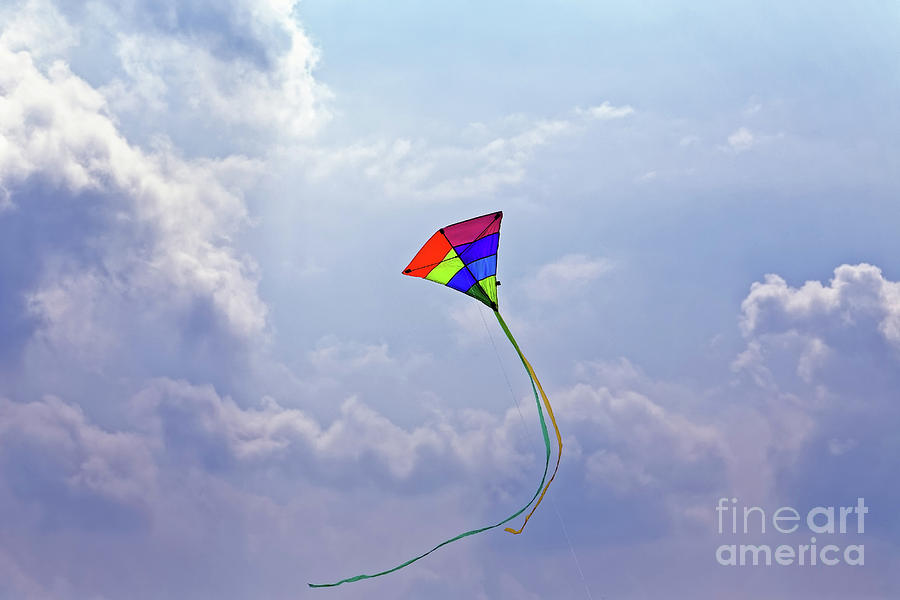 High Flying Multicolored Red Yellow Green Blue Purple Triangular Kite Flying Sunny Cloudy Blue Sky Photograph by Robert C Paulson Jr
