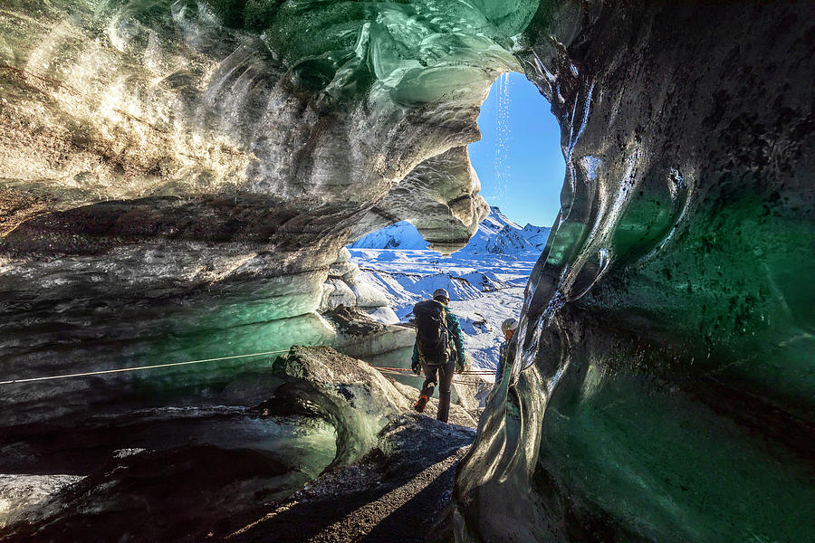 Hiker Exploring Cave, Iceland Digital Art by Maurizio Rellini