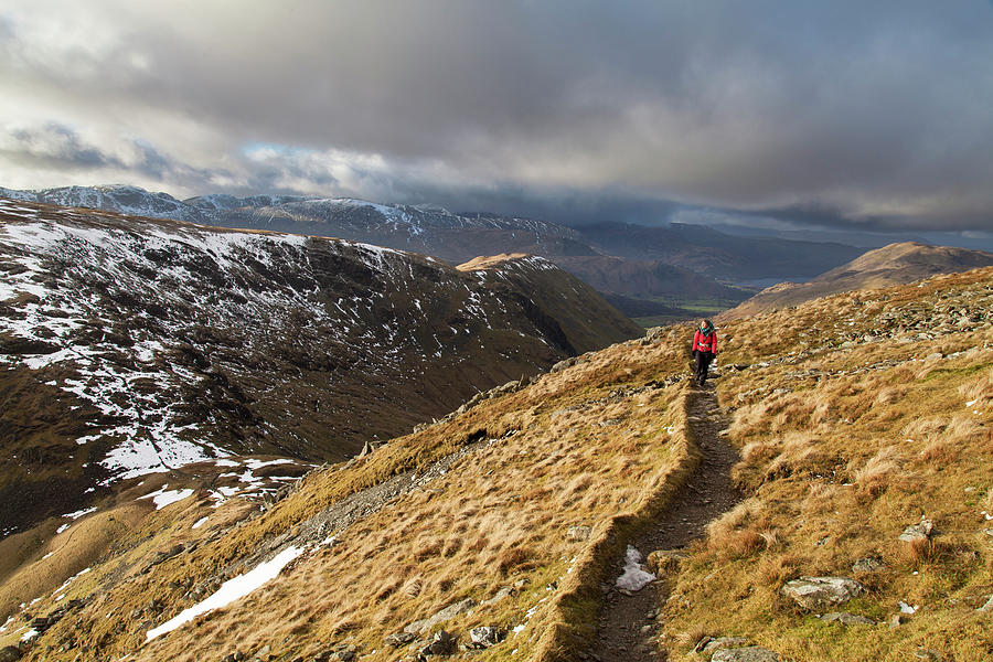 Hiker Follows Path Along Mountainside Photograph by Ascent Xmedia