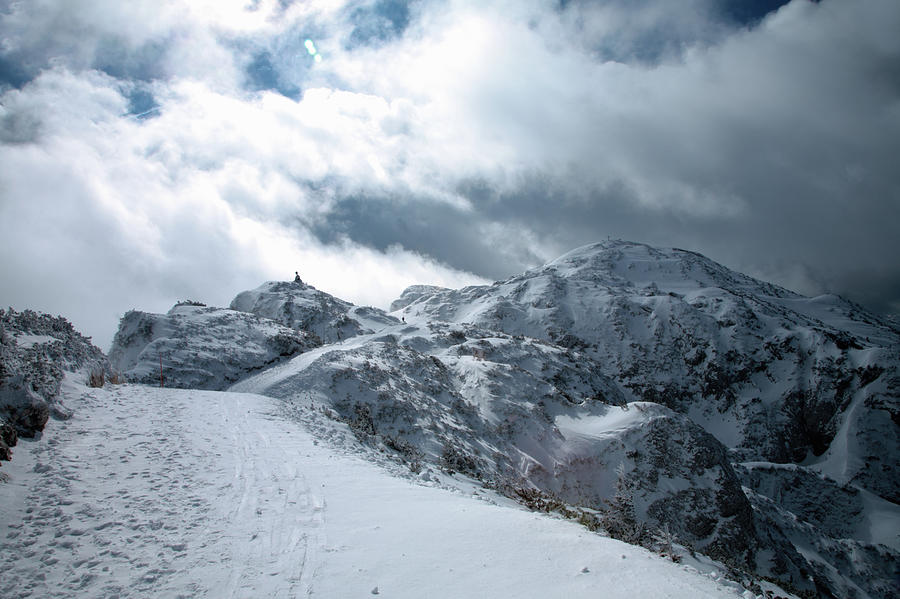 flamme burst ubemandede Hiker On Snowy Mountaintop by Cultura Exclusive/jesper Mattias