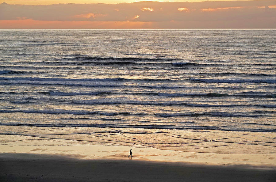Hiker on the beach in Newport, Oregon Photograph by Buddy Mays