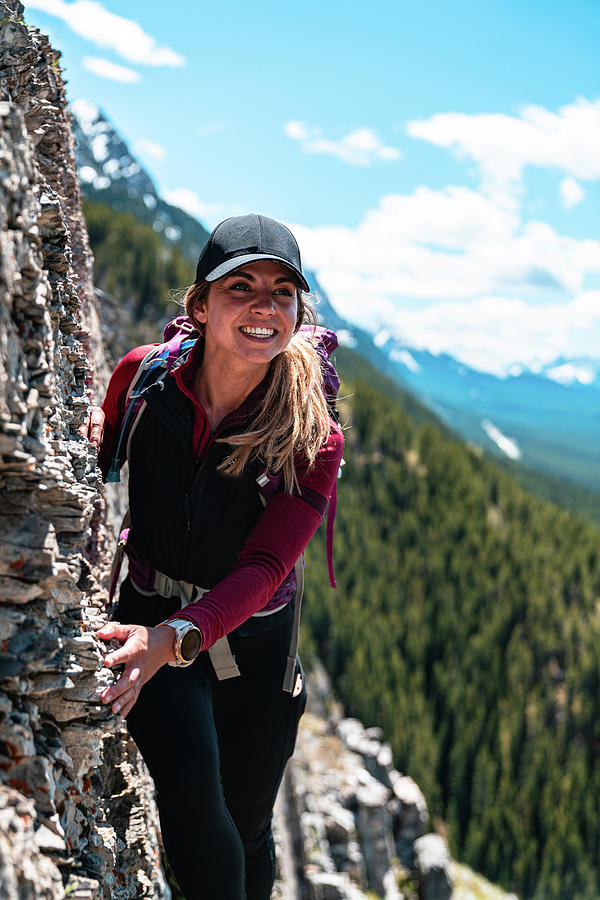 Hiker Smiling On Mountain Ridge High Above Valley Bellow Photograph by ...