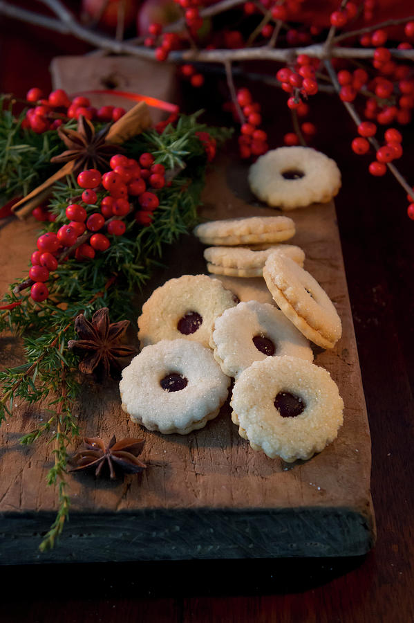 Hildabrtchen german Jam Sandwich Biscuits And Bunches Of Holly Berries Photograph by Martina Schindler