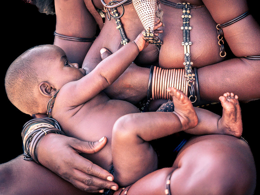 Himba Mother Feedings Her Baby Photograph by Eyal Alcalay