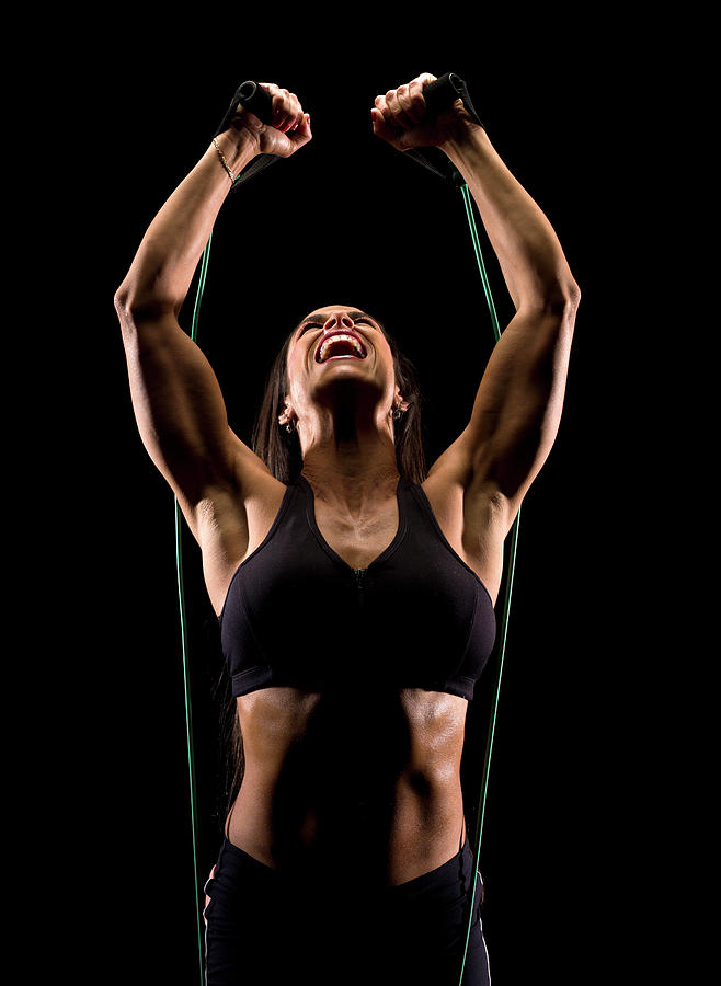 Hispanic Woman Exercising Photograph by Juanmonino