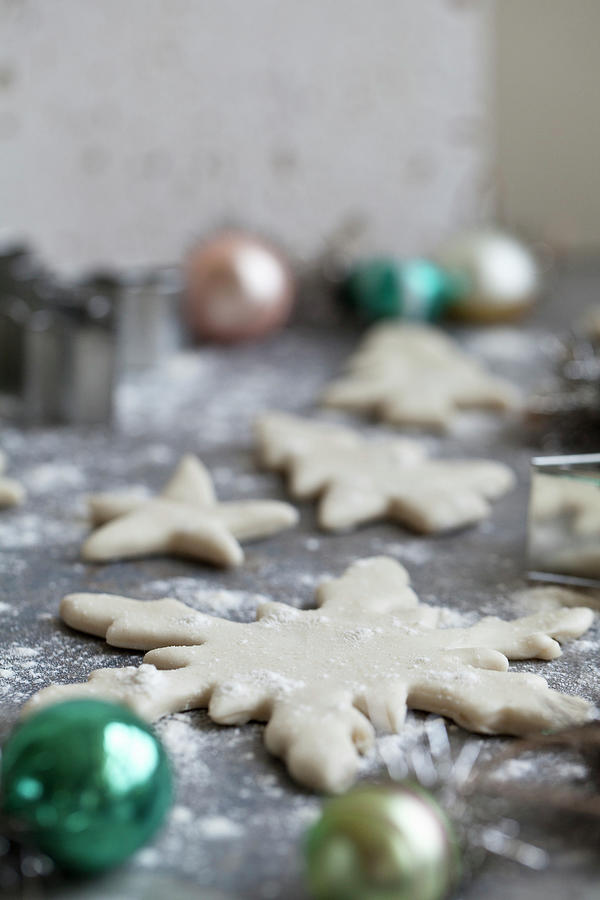 Holiday Cookies Being Made And Dusted With Flour - With Snowflake And Star Cookie Cutters And Ornaments Sitting Beside Photograph by Ryla Campbell