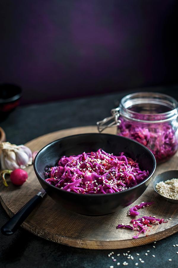 Home Made Red Cabbage Kimchi In A Bowl, Jar In The Background Photograph by Magdalena Hendey